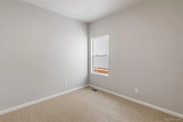a bathroom with a toilet and a bathtub