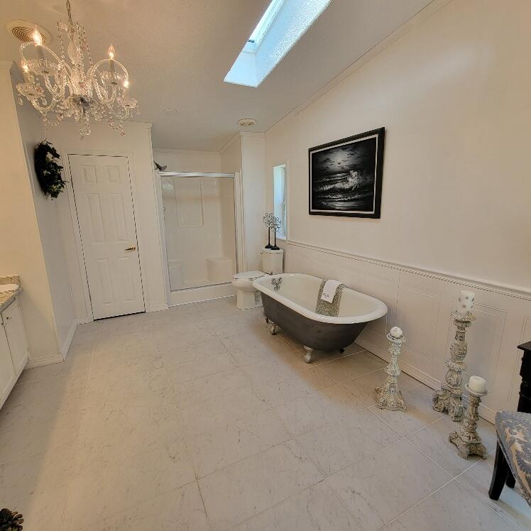 428 Green Level Road Boones Mill, VA 24065 - Photo 34 of 55 a bathroom with a toilet a sink and mirror
