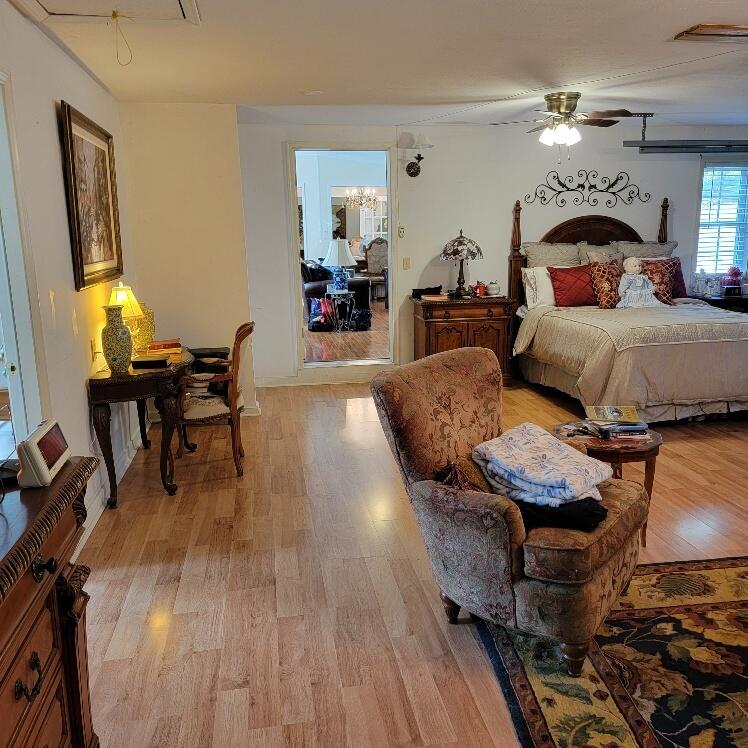 428 Green Level Road Boones Mill, VA 24065 - Photo 44 of 55 a bedroom with furniture and a wooden floor