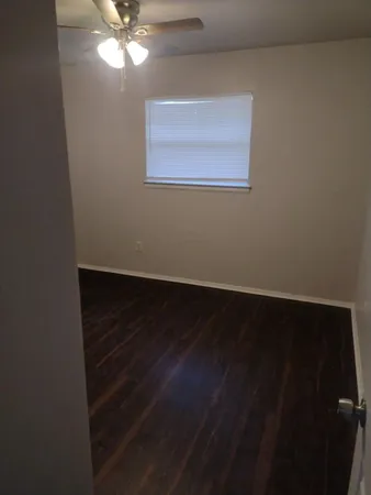 a bathroom with a toilet and bathtub