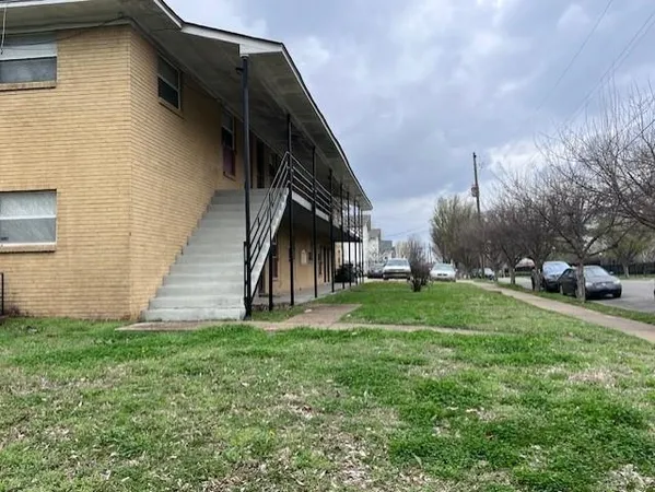a view of building with truck parked