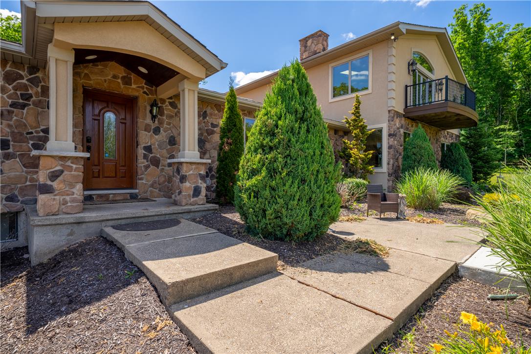 374 Packer Drive Weatherly, PA 18255 - Photo 3 of 30 A stone-clad facade with a covered entry and a charming second-story balcony offers inviting curb appeal.