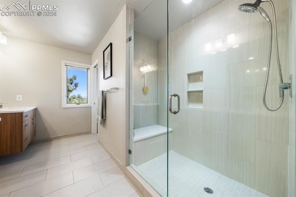220 Preservation Way Colorado Springs, CO 80919 - Photo 17 of 39 a bathroom with a shower and a sink