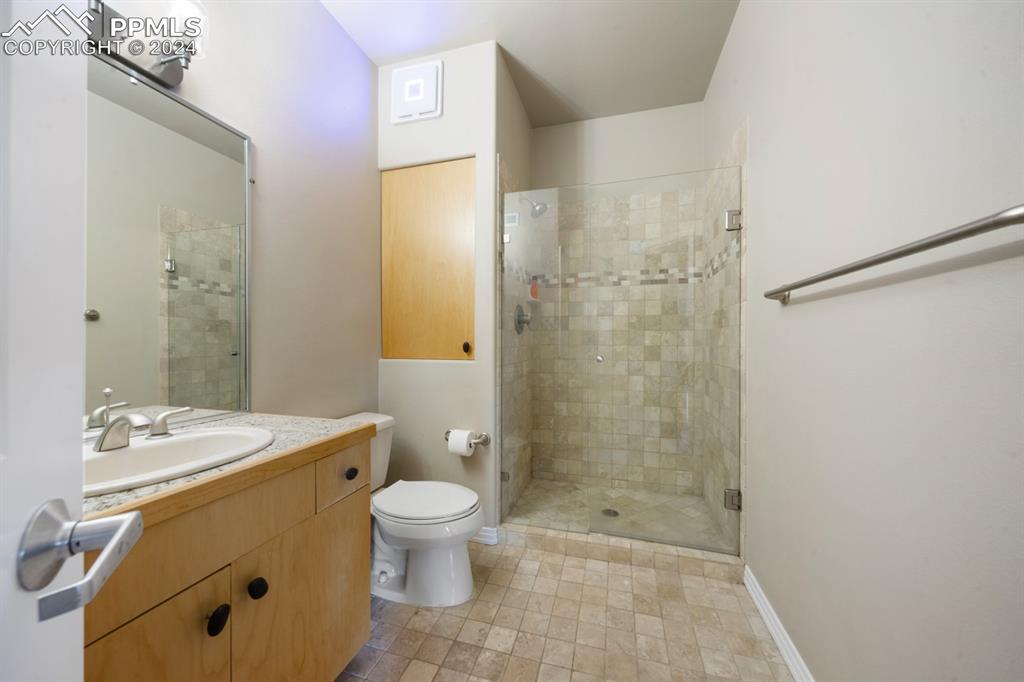 220 Preservation Way Colorado Springs, CO 80919 - Photo 20 of 39 a bathroom with a sink a toilet and shower