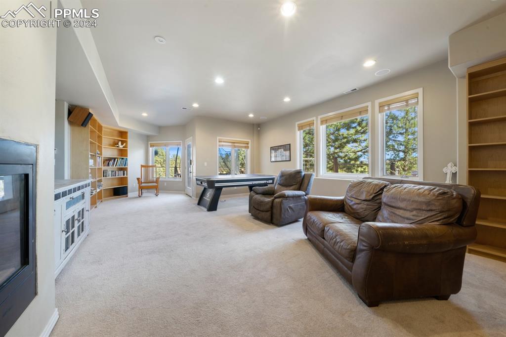 220 Preservation Way Colorado Springs, CO 80919 - Photo 25 of 39 a living room with furniture and a large window