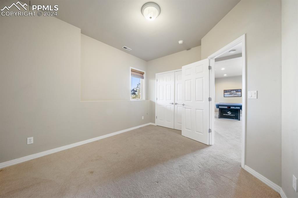 220 Preservation Way Colorado Springs, CO 80919 - Photo 29 of 39 an empty room with windows and entrance