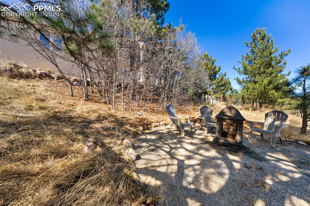 220 Preservation Way Colorado Springs, CO 80919 - Photo 32 of 39 a backyard of a house with table and chairs