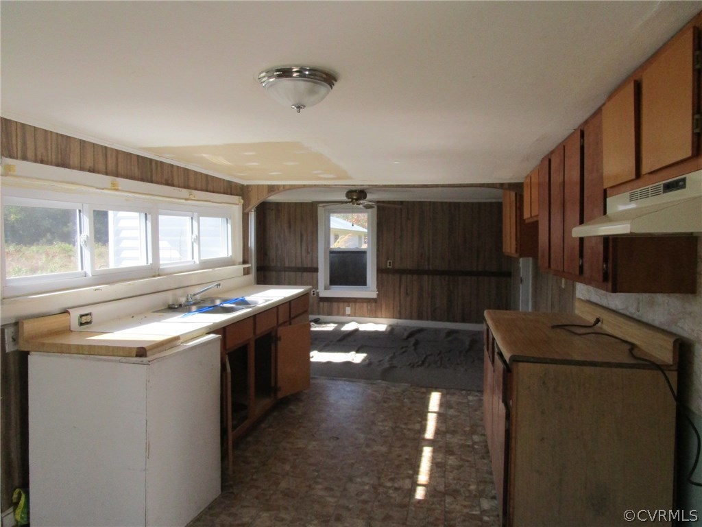 109 Holly Point Road Mathews, VA 23109 - Photo 7 of 15 a kitchen with stainless steel appliances granite countertop a sink and stove