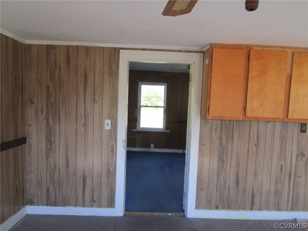 109 Holly Point Road Mathews, VA 23109 - Photo 8 of 15 a view of a hallway with wooden shelves