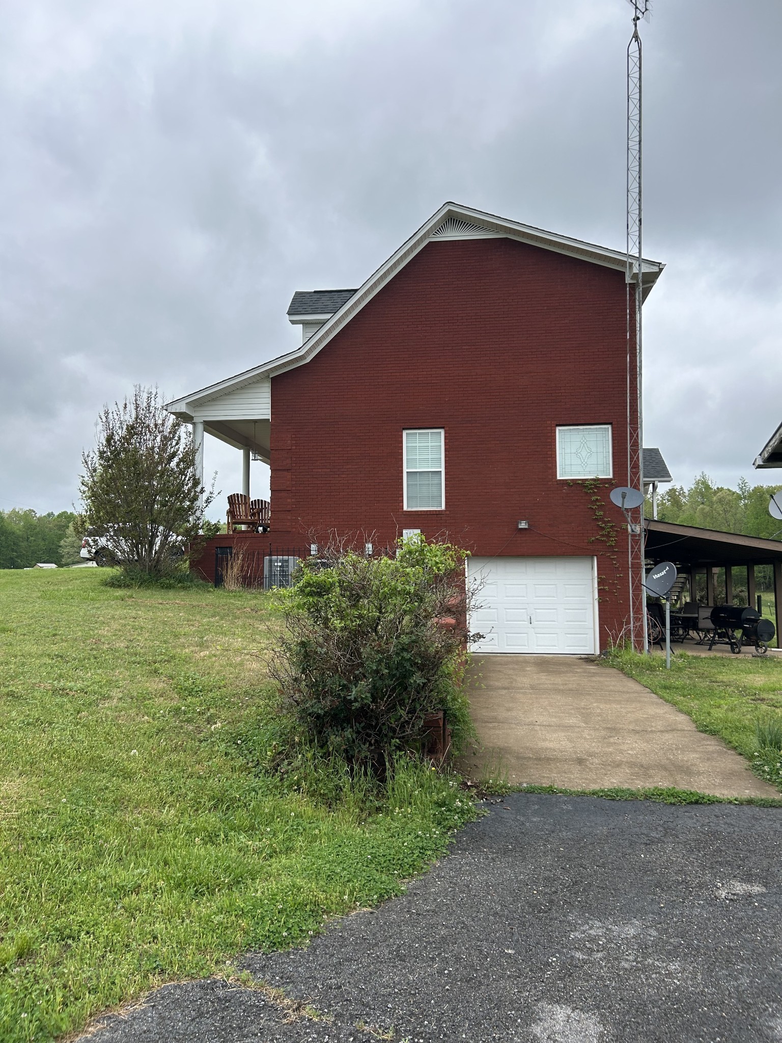 3421 George Olive Road Iron City, TN 38463 - Photo 6 of 51 a front view of a house with garden