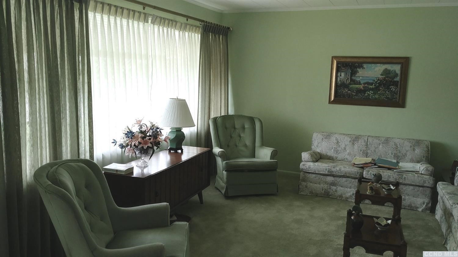 84 Latham Ridge Road Latham, NY 12110 - Photo 3 of 10 a living room with furniture and a window