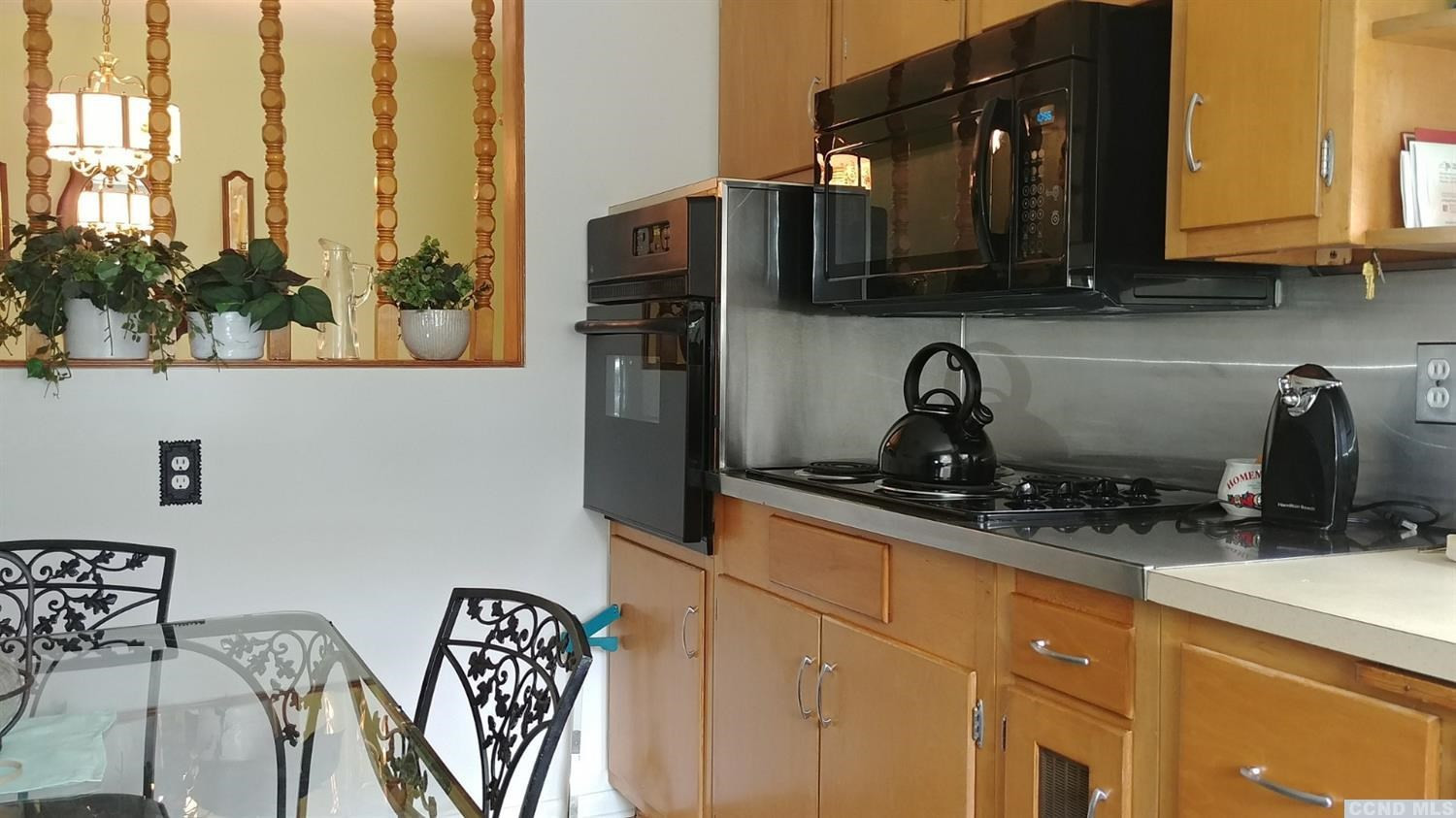 84 Latham Ridge Road Latham, NY 12110 - Photo 5 of 10 a kitchen with stainless steel appliances granite countertop a refrigerator and a sink