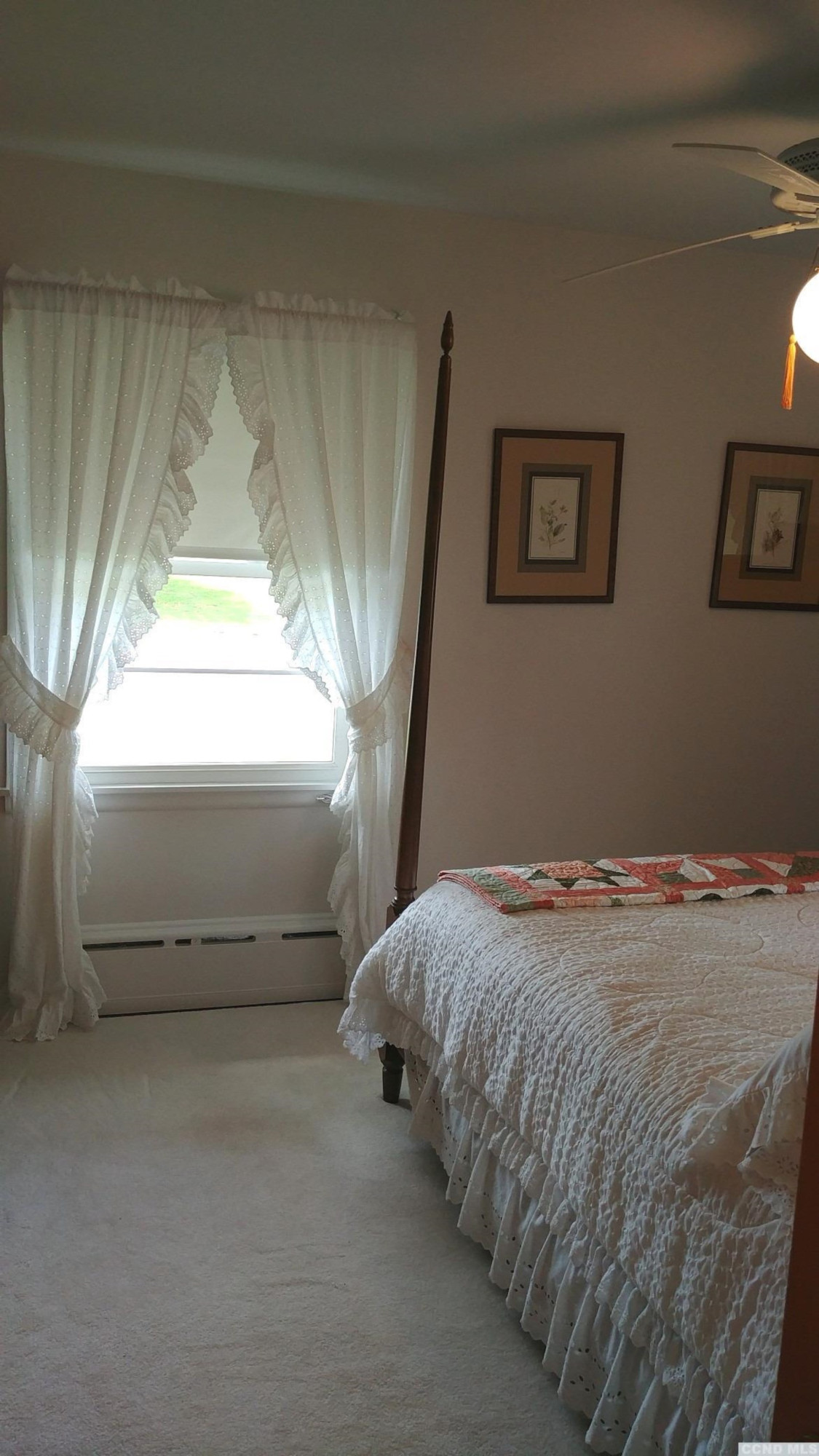 84 Latham Ridge Road Latham, NY 12110 - Photo 8 of 10 a bed sitting in a bedroom next to a window
