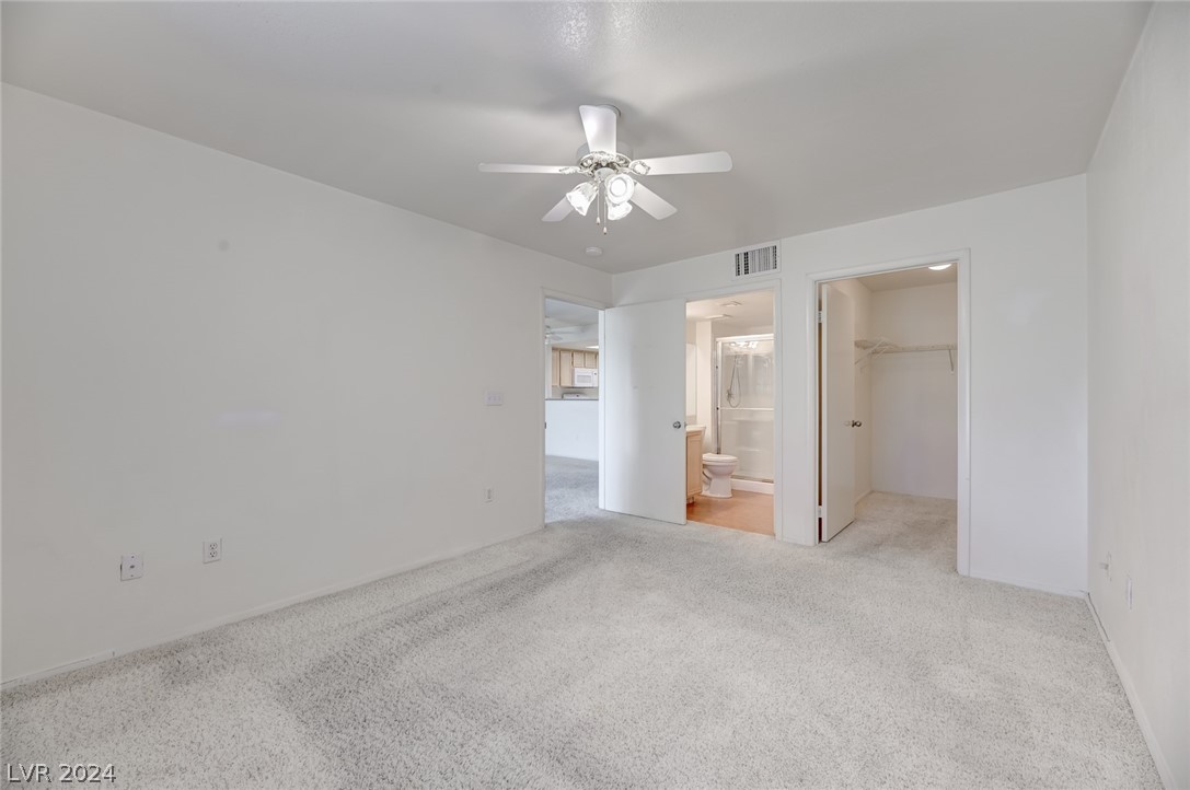 1908 Rio Canyon Court, Unit 202 Las Vegas, NV 89128 - Photo 12 of 29 MASTER BEDROOM WITH WALK-IN CLOSET