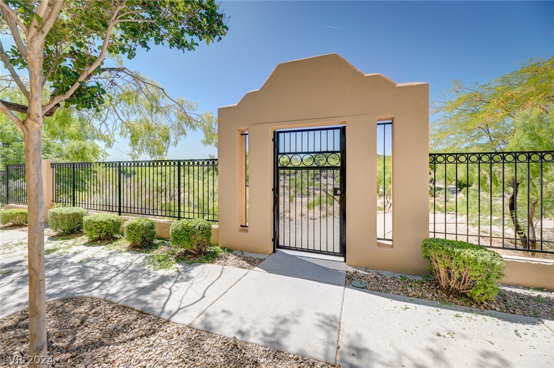 1908 Rio Canyon Court, Unit 202 Las Vegas, NV 89128 - Photo 3 of 29 GATE WITH YOUR OWN KEY LEADING TO PUEBLO PARK & NA