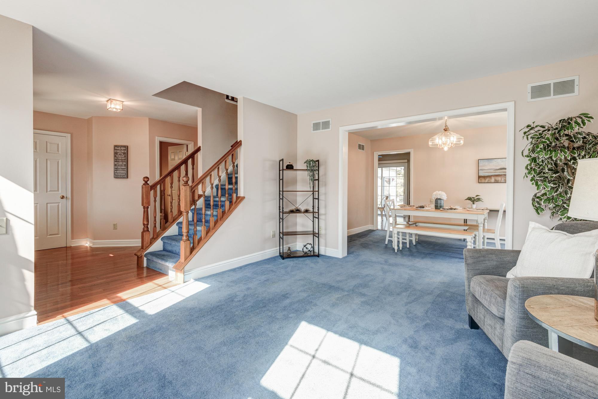 21 Oakview Drive Newark, DE 19702 - Photo 19 of 65 a living room with furniture and a dining table with kitchen view