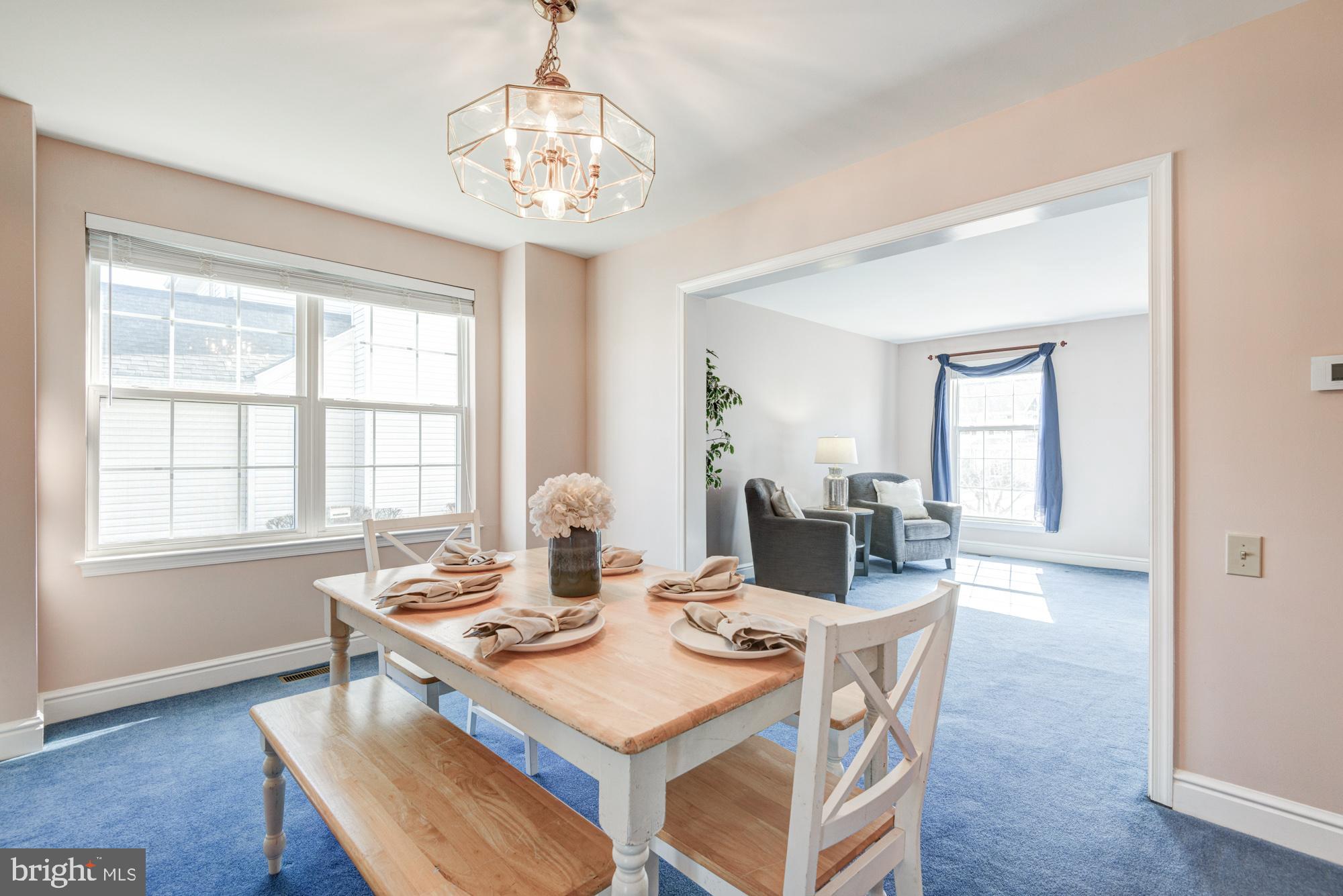 21 Oakview Drive Newark, DE 19702 - Photo 24 of 65 a view of a dining room with furniture window and wooden floor
