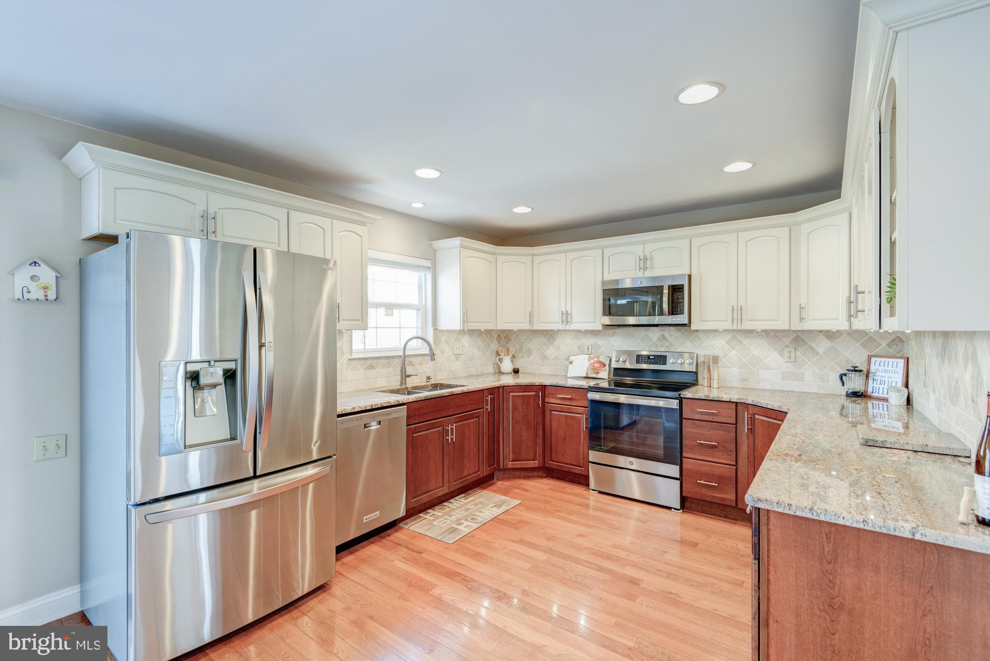 21 Oakview Drive Newark, DE 19702 - Photo 25 of 65 a kitchen with stainless steel appliances granite countertop a refrigerator sink and stove