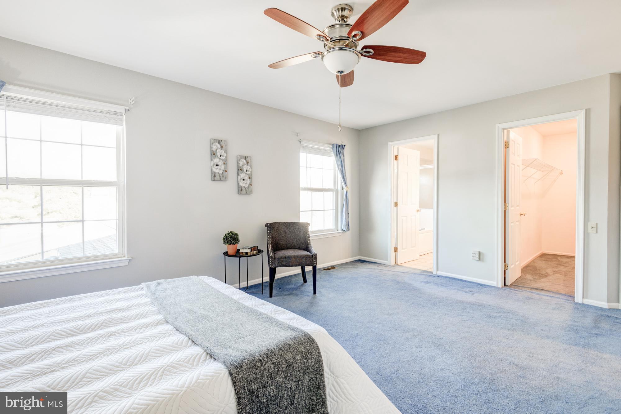 21 Oakview Drive Newark, DE 19702 - Photo 42 of 65 a bedroom with a bed and a chandelier