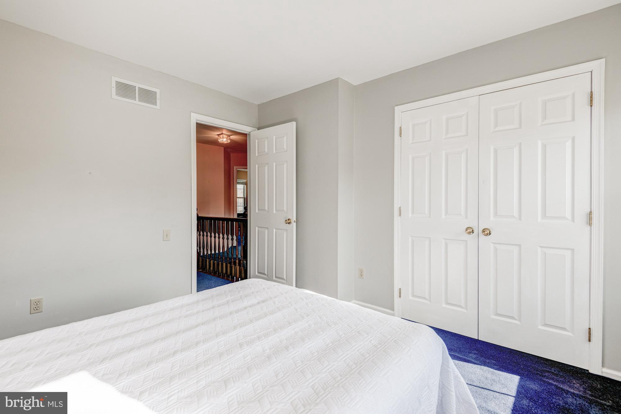 21 Oakview Drive Newark, DE 19702 - Photo 47 of 65 a bedroom with a bed and wooden floor