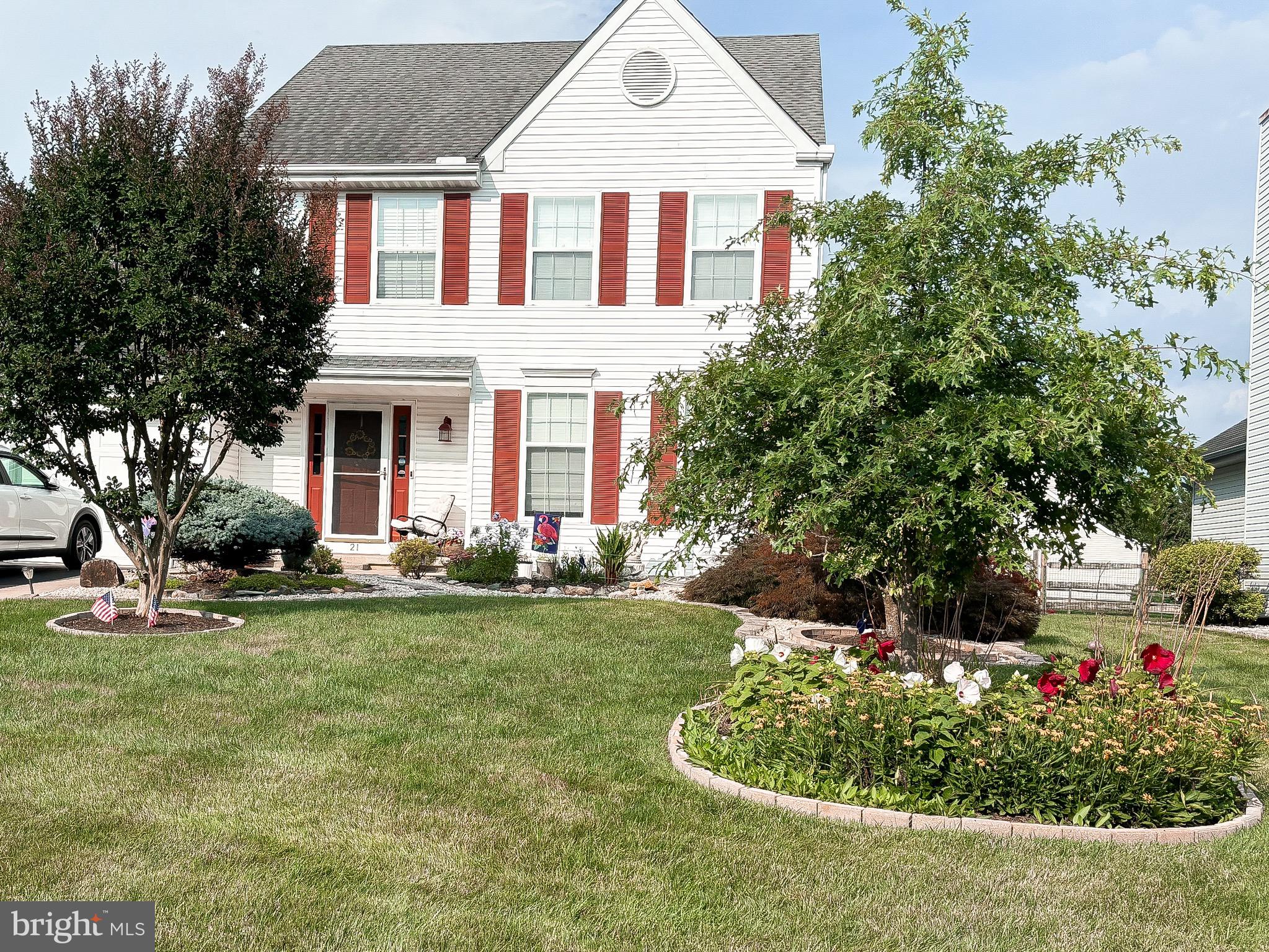 21 Oakview Drive Newark, DE 19702 - Photo 7 of 65 a front view of a house with a yard and garage