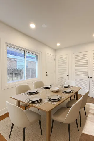 a view of a dining room with furniture and window