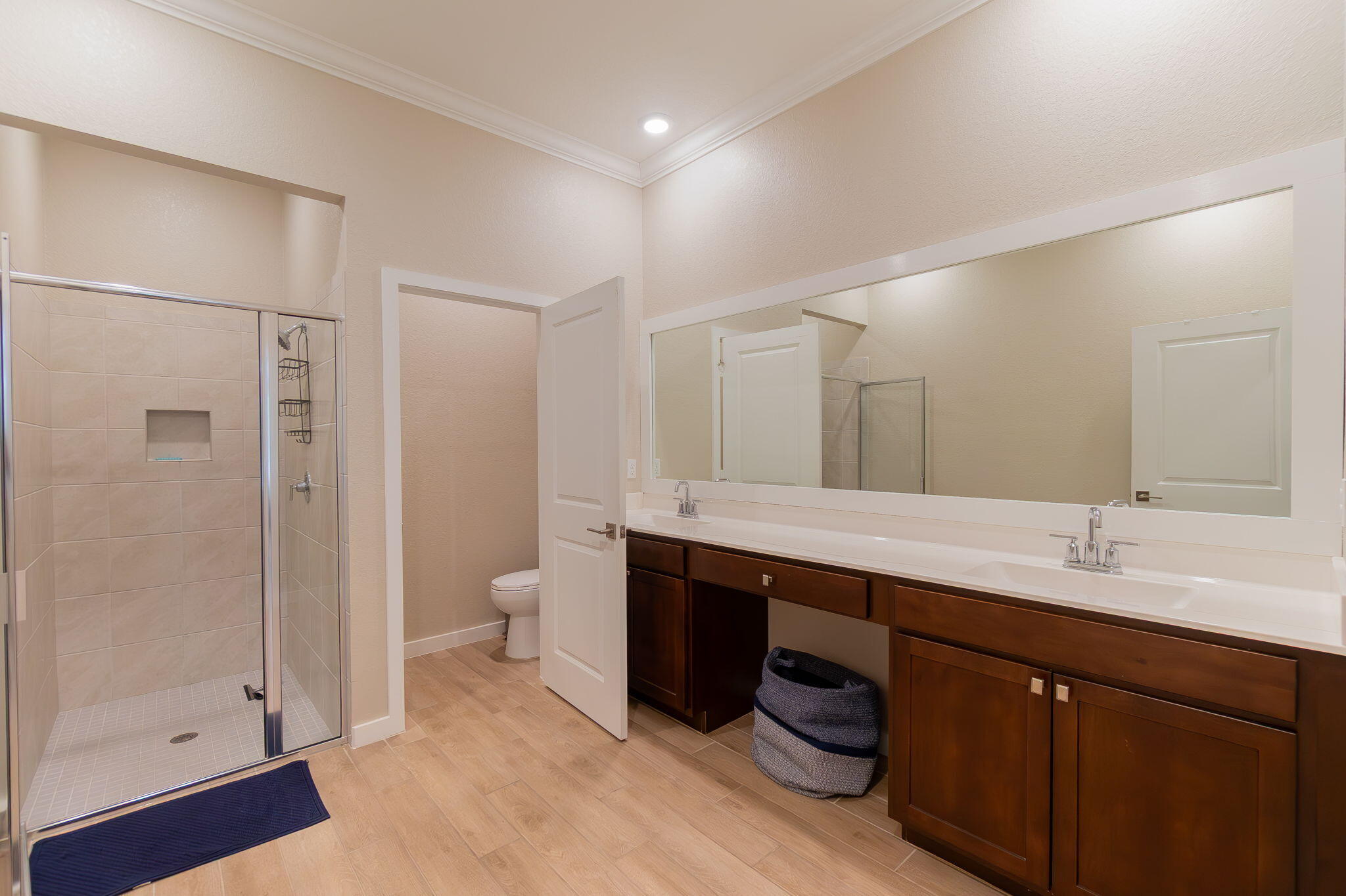 19546 Weathervane Way Loxahatchee, FL 33470 - Photo 29 of 63 a spacious bathroom with a double vanity sink toilet and shower