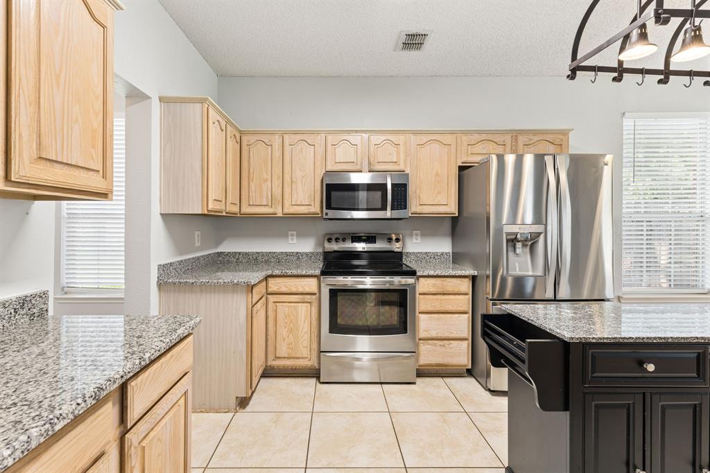 3304 Olympus Court Corinth, TX 76210 - Photo 14 of 40 Stainless steel appliances.