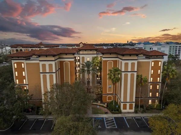 a view of a residential apartment building with a yard