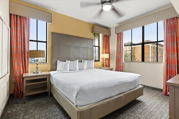 a bathroom with a toilet a sink and glass door
