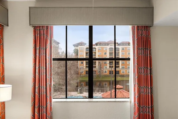 a bedroom with two bed and a flat screen tv