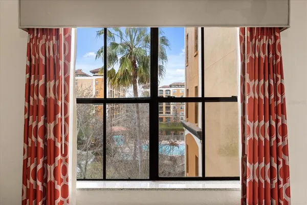 a bathroom with a sink mirror and shower