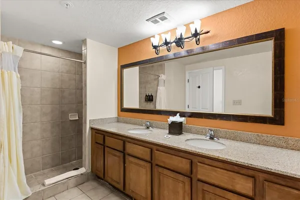 a bathroom with a bathtub and shower