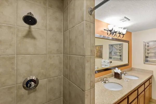 a bathroom with a bathtub and shower