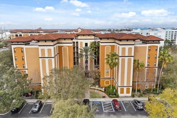 aerial view of a residential apartment building with a yard