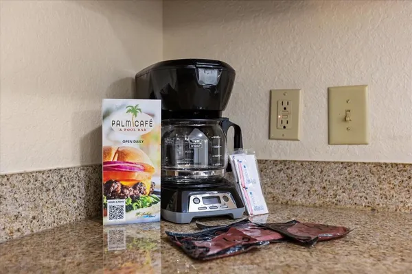 a kitchen with cabinets and wooden floor