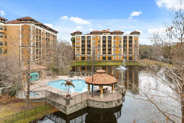 a view of game room with window and wooden floor