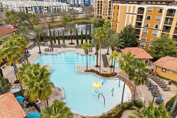 a view of swimming pool with outdoor seating