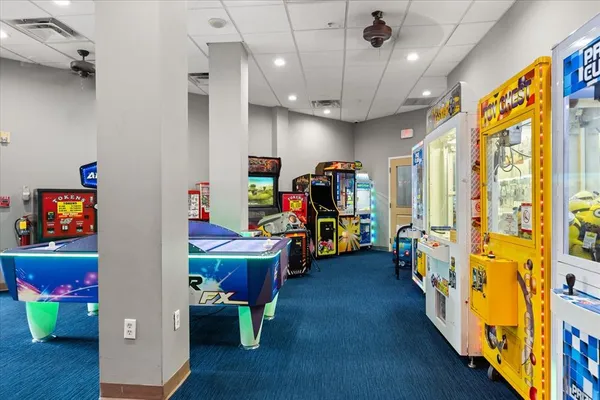 an aerial view of a balcony with outdoor seating