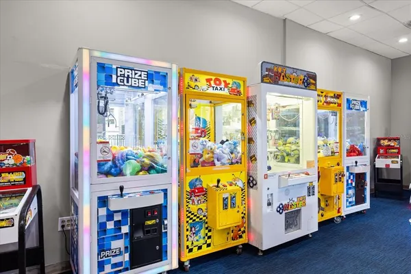 an aerial view of a house with outdoor space and seating area