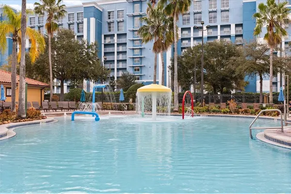 a balcony with wooden floor and city view