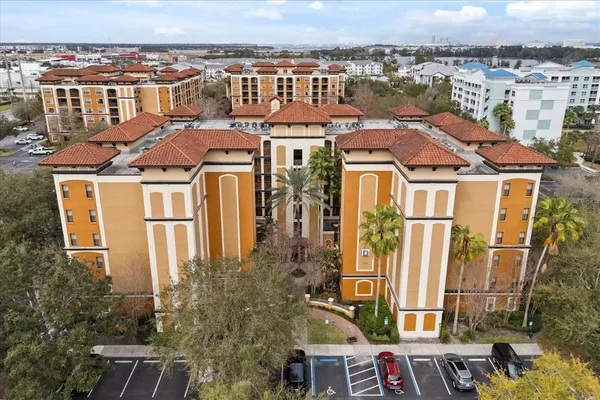 an aerial view of a residential apartment building with a yard
