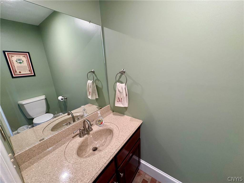 7892 East Ridge Pointe Drive Manlius, NY 13066 - Photo 23 of 46 Half bath is conveniently located for quick access from the pool or yard.