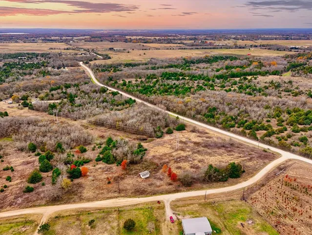 an aerial view of residential houses and outdoor space