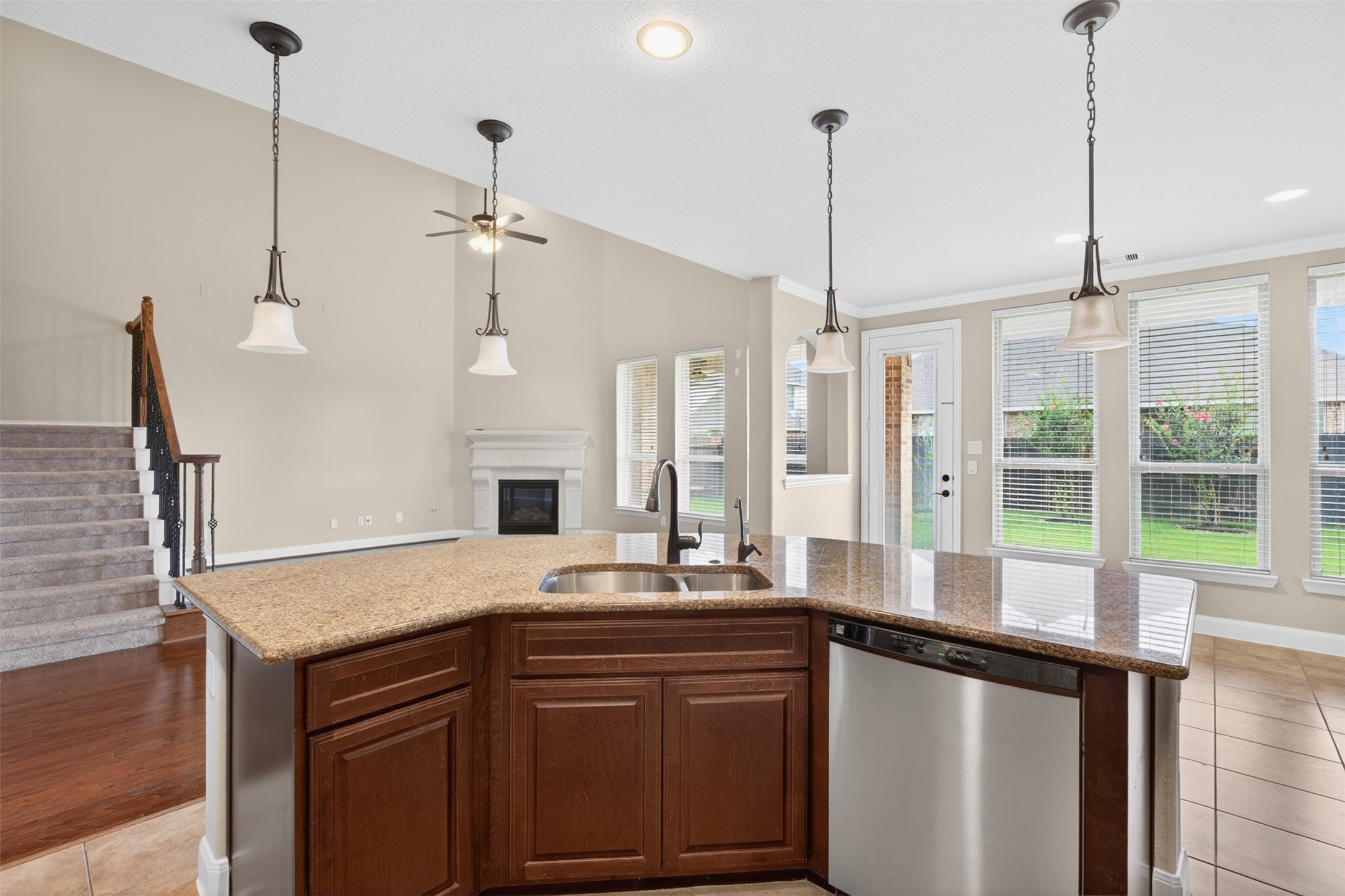 18202 Wedgewood Bluff Court Spring, TX 77379 - Photo 24 of 50 Kitchen view looking into the living room, ideal for everyday entertaining.