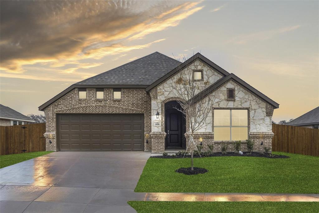 208 Magnolia Drive Azle, TX 76020 - Photo 1 of 1 a front view of a house with a yard and garage