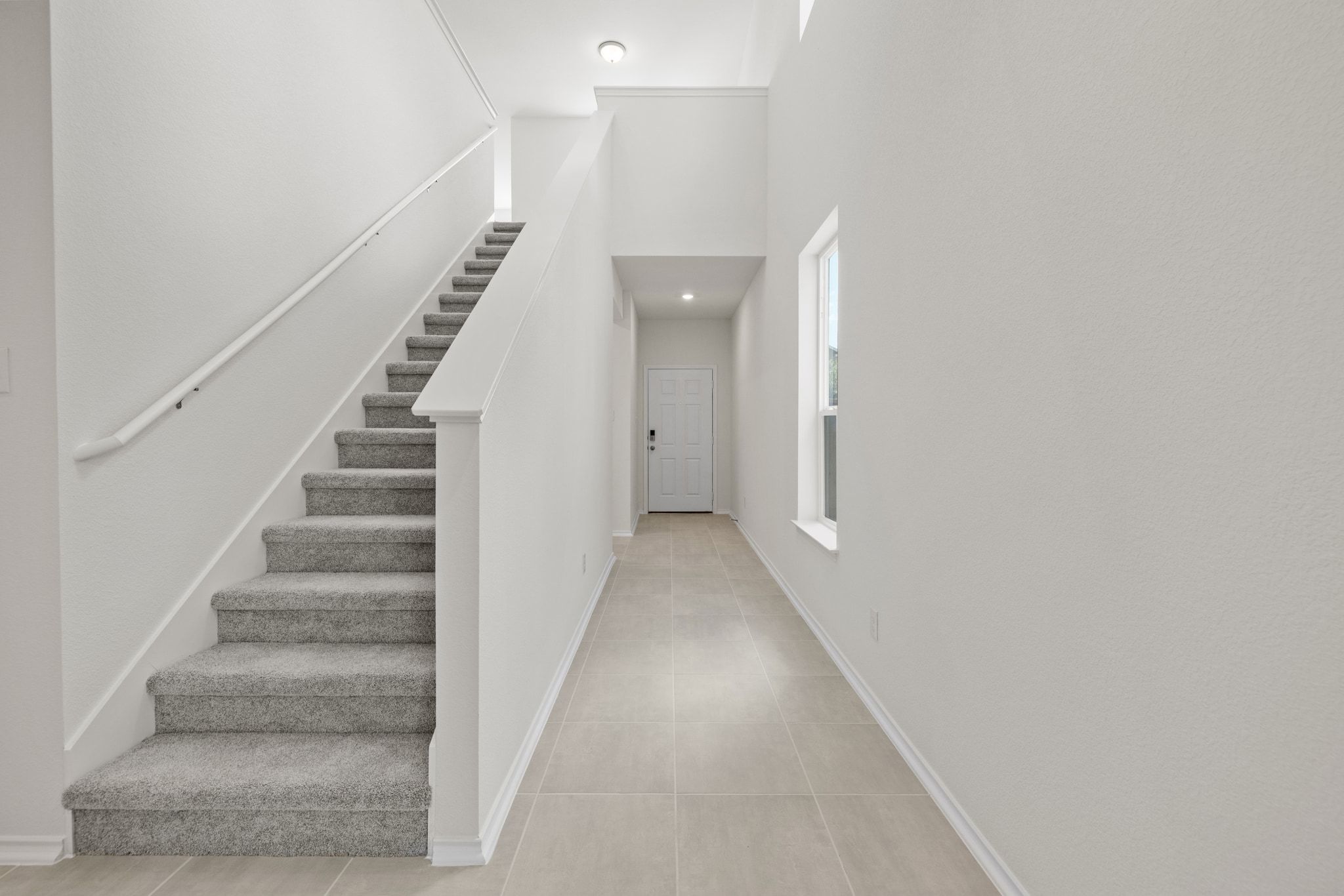 248 Feathers Street Jarrell, TX 76537 - Photo 12 of 32 a view of staircase with white walls