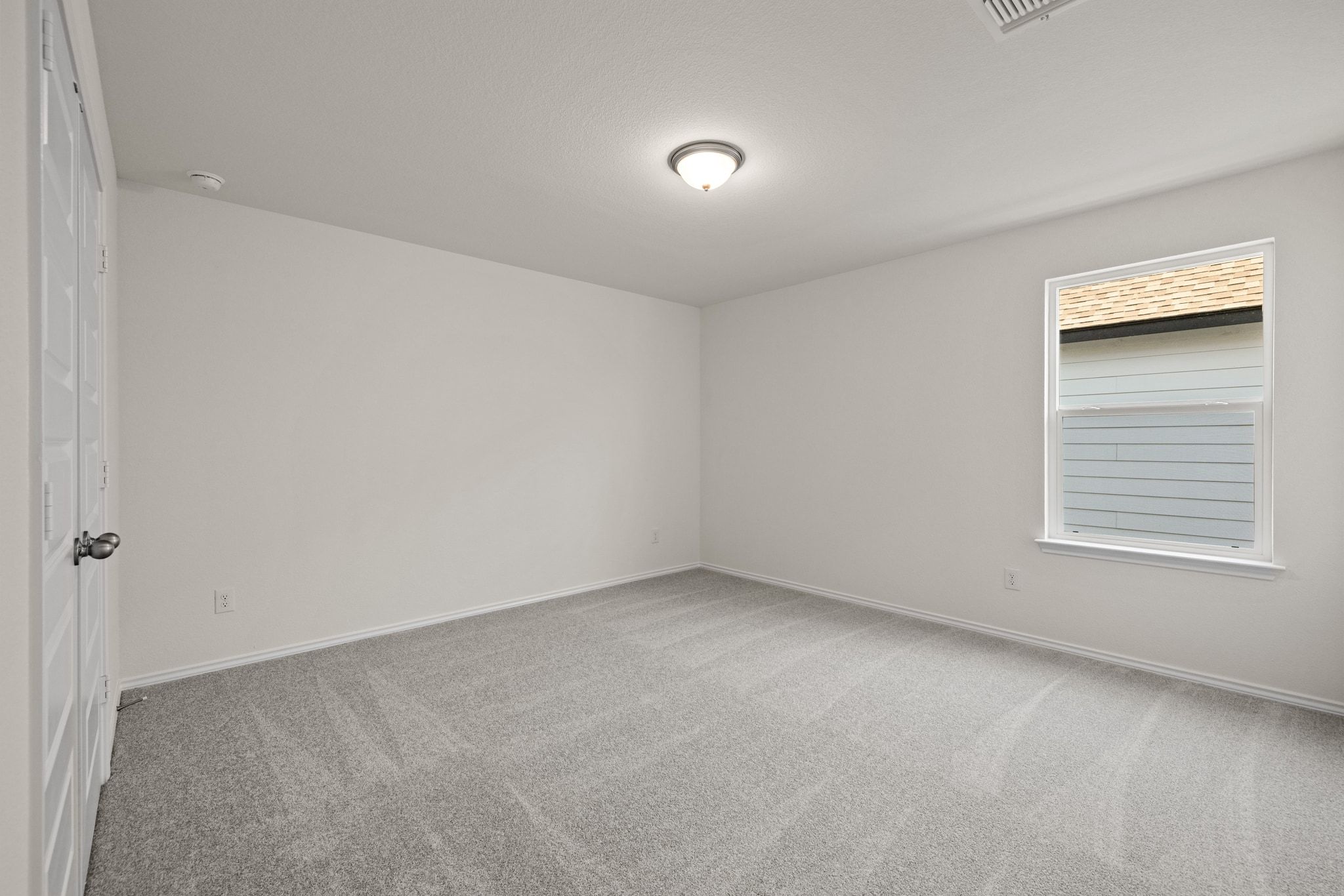 248 Feathers Street Jarrell, TX 76537 - Photo 21 of 32 an empty room with a window