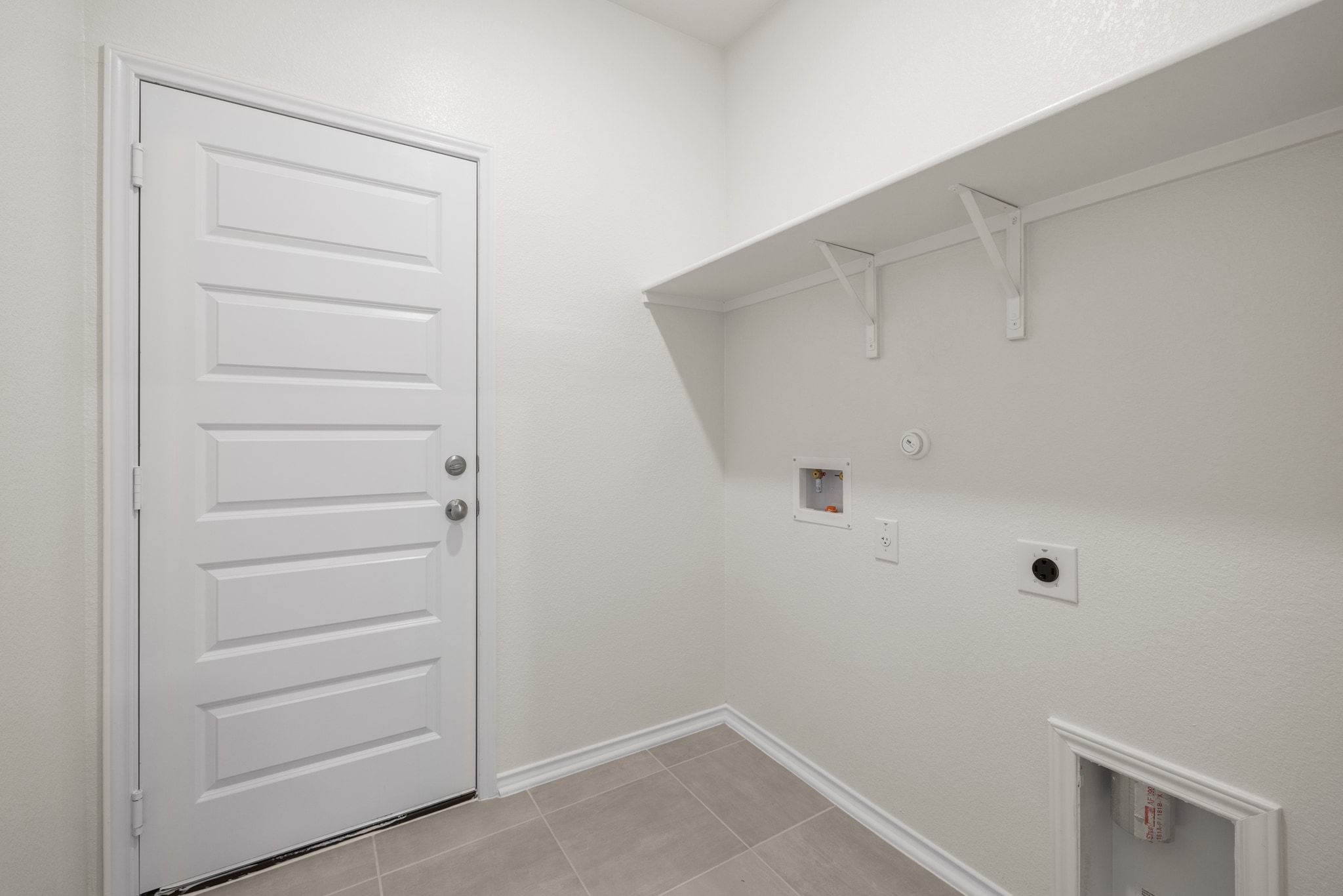 248 Feathers Street Jarrell, TX 76537 - Photo 24 of 32 a view of walk in closet with empty racks