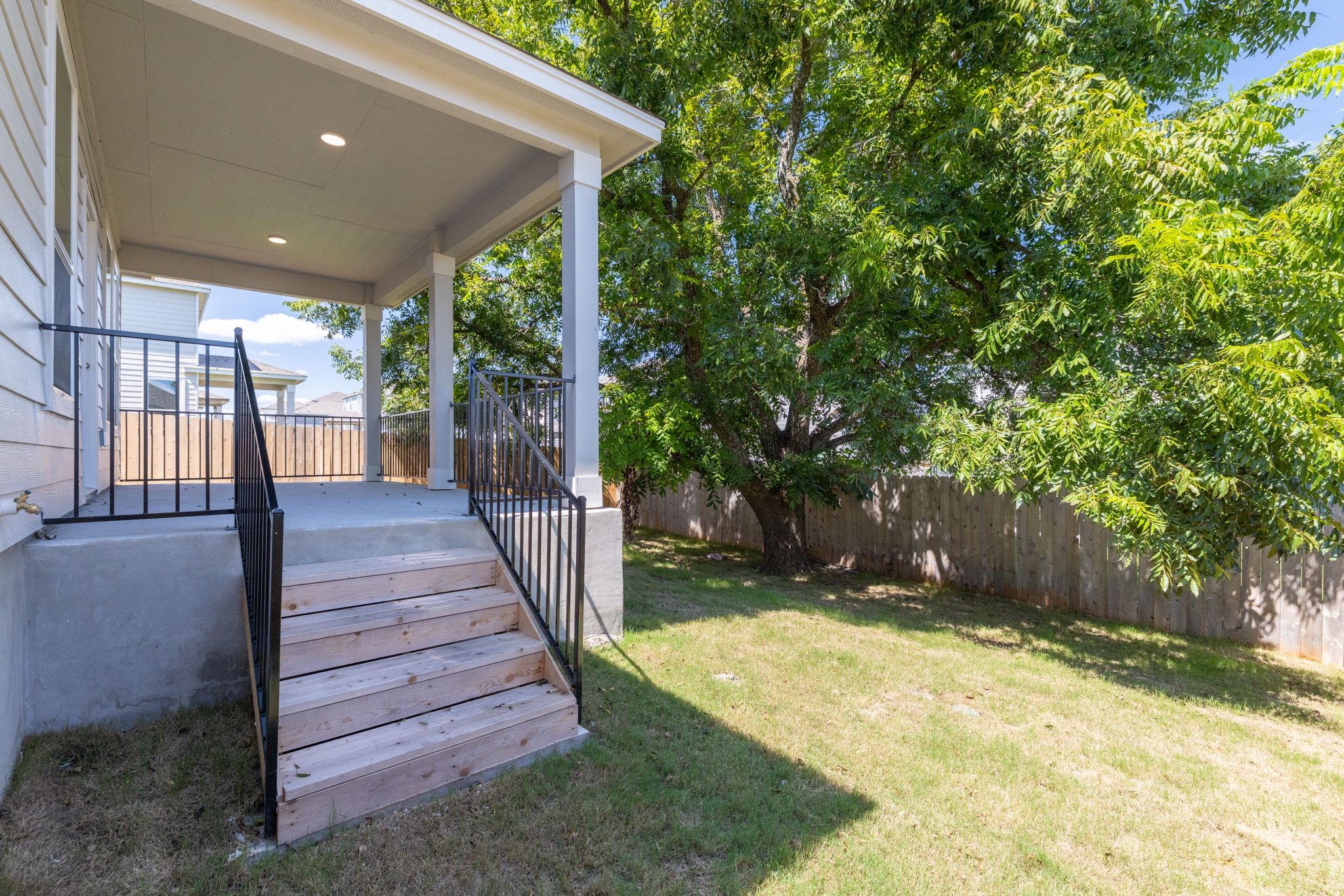 248 Feathers Street Jarrell, TX 76537 - Photo 28 of 32 a view of a porch with wooden stairs and a yard